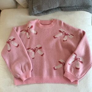 Pink Sweater with Bow Design